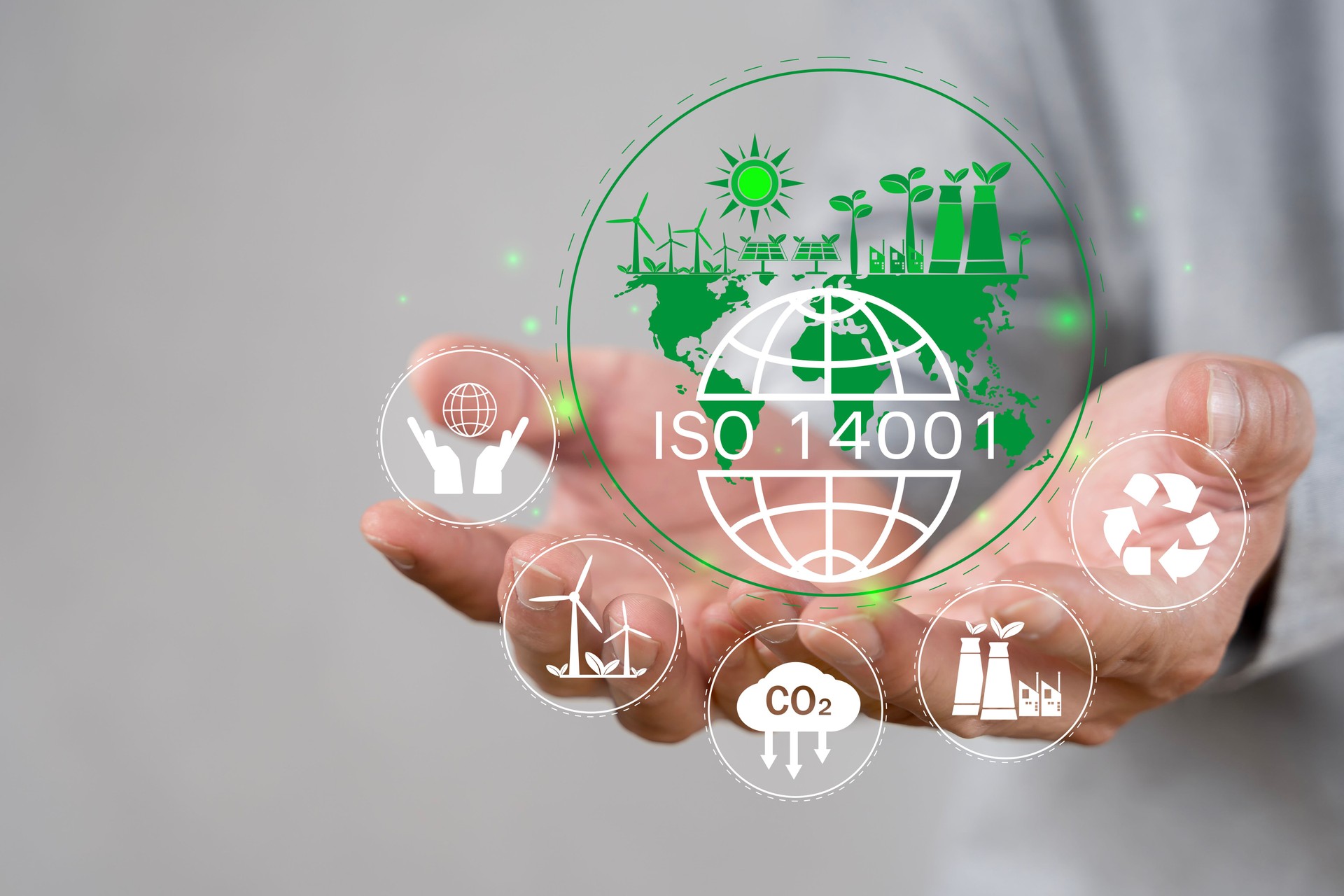 ISO 14001 concept. Businessman touch virtual icon of ISO 14001 certified for environmental management systems