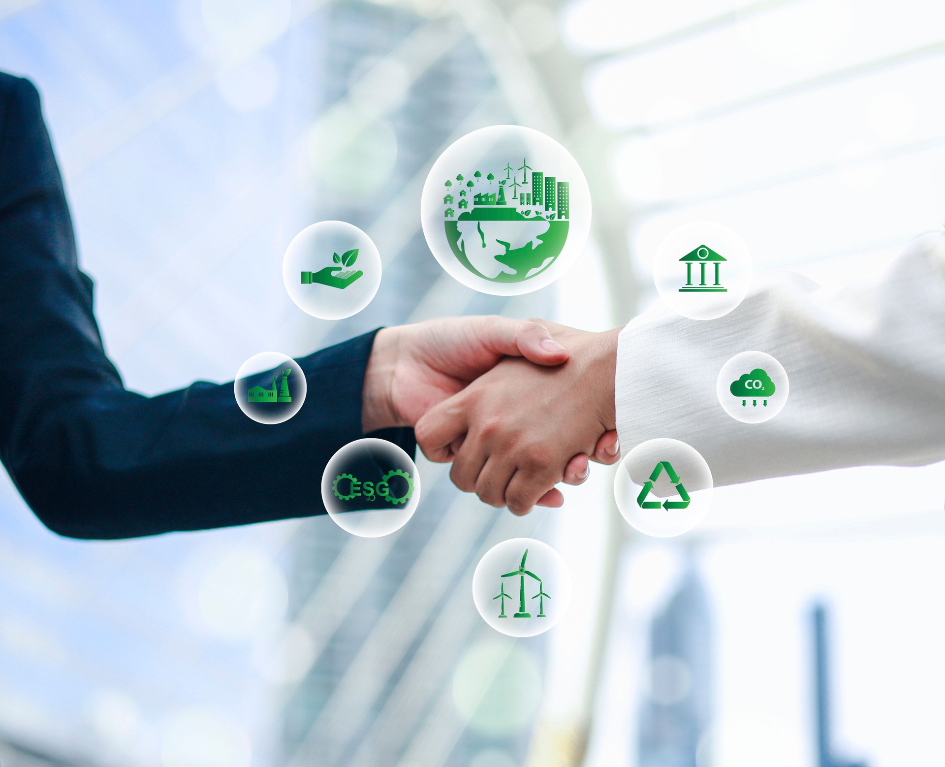 Business partners colleagues on World Environment Day shaking hands during meeting to work together for sustainability. Green concept with Co2 icon.