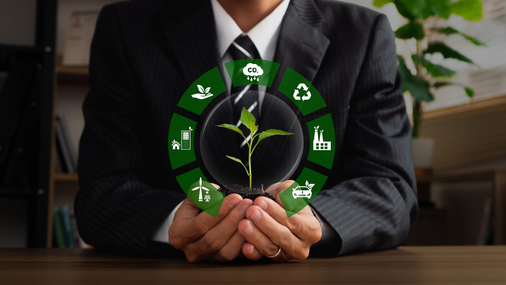 Businessman holding plants with icons of green business for ESG, co2, and net zero. Concept of sustainable development, SDGs, Green technology, World Earth Day and Environmental technology.